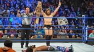 Bryan celebrates his victory, which means Kingston will not challenge him at WrestleMania.